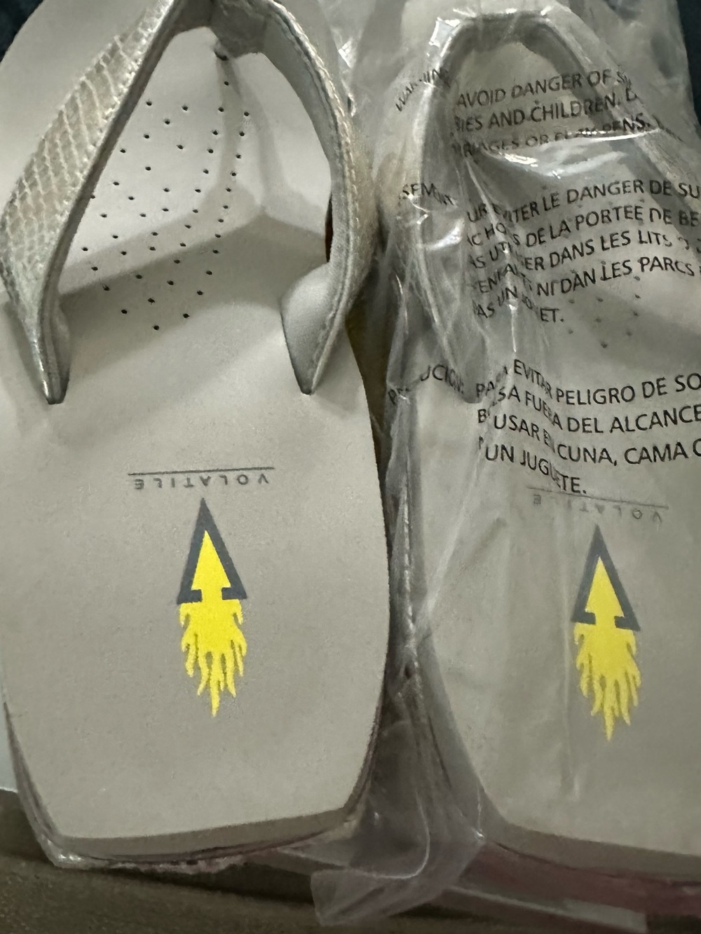 Volatile Gray-Beige Flip Flops with Yellow Flame Logo